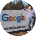 man standing in front of google sign