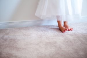 women's feet on carpet